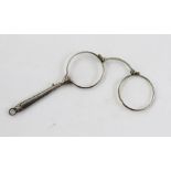 A PAIR OF SILVER COLOURED METAL LORGNETTES having bright cut decorated handle, stamped .935