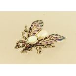 A MARCASITE, ENAMEL AND SILVER COLOURED METAL MOUNTED INSECT BROOCH having ruby set eyes, opal