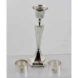 AN EARLY 20TH CENTURY SILVER CANDLESTICK of Georgian design, having tapering stem on hexagonal base,