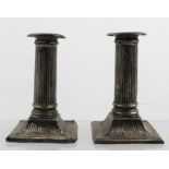 POSSIBLY FORDHAM AND FAULKNER A PAIR OF EDWARDIAN SILVER COLUMN DESIGN CANDLESTICKS on squared