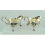 F.C. RICHARDS A PAIR OF GEORGE II STYLE SILVER SAUCE BOATS each with double scrolling handle, raised