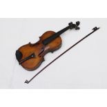 A LATE 19TH CENTURY VIOLIN, with carved scroll peg box, figured two-piece back, 35cm, in case with