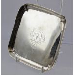 AN 18TH CENTURY SQUARE SILVER CARD TRAY, having raised rim on applied bracket feet, engraved