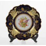 A 19TH CENTURY RIDGWAYS PLATE, the centre decorated with a basket of flowers within a decorative