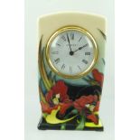 A MOORCROFT "SATIN FLOWER" PATTERN CLOCK, hand painted and tubed lined decoration, fitted movement