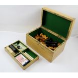 A PAINTED WOOD GAMES BOX, baize lined, contains Staunton pattern chessmen and other games, 28cm wide