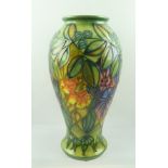 A MOORCROFT "RAIN FOREST" PATTERN VASE, hand painted and tube lined decoration, of baluster form,