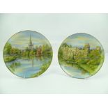 A PAIR OF ROYAL WORCESTER CABINET PLATES, having hand painted scenes "Warwick Castle" and "Holy