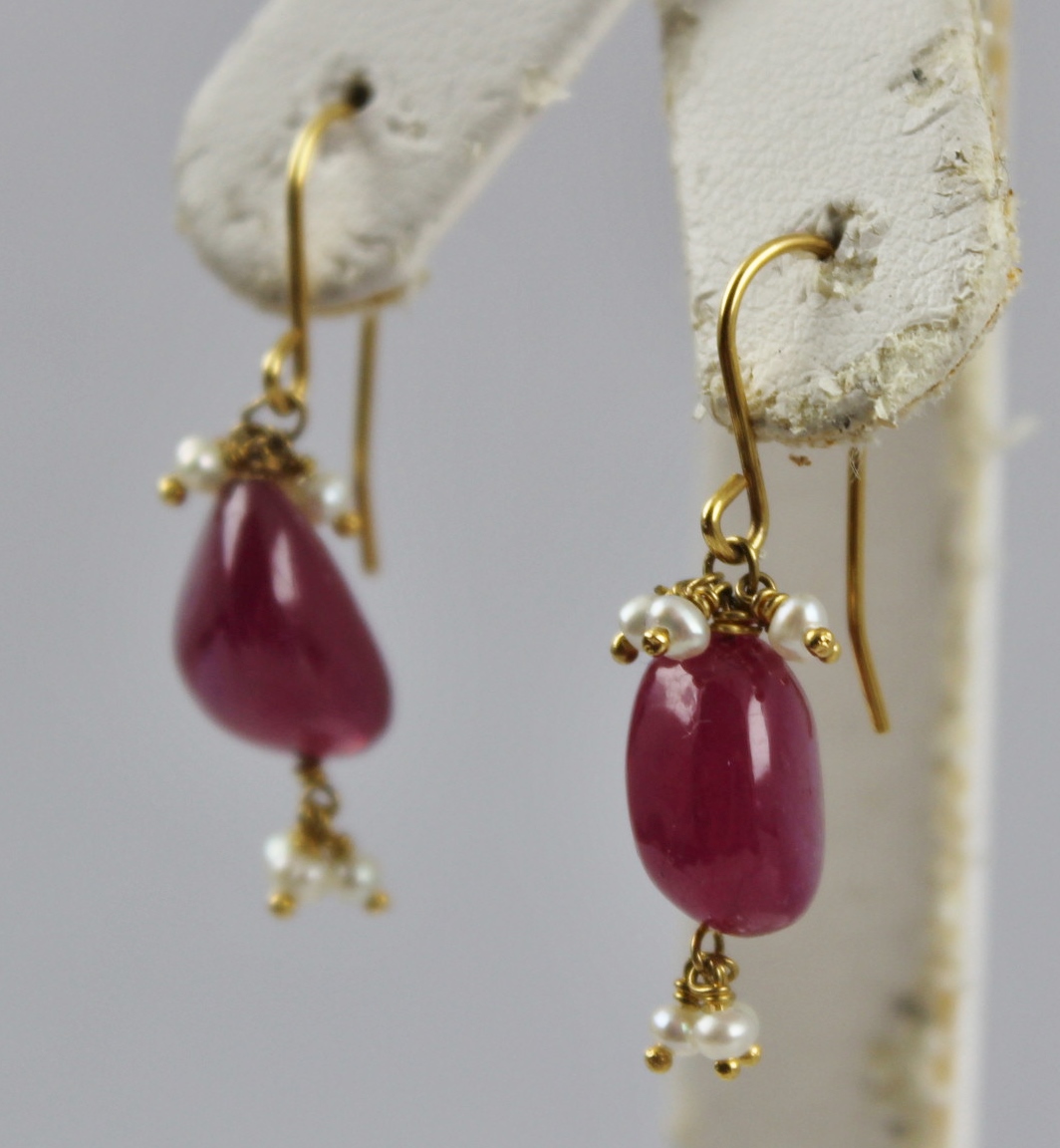 A PAIR OF GOLD COLOURED METAL MOUNTED RUBY AND SEED PEARL EARRINGS, each having a polished pebble - Image 2 of 2