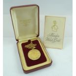 A 1979 GOLD SOVEREIGN mounted within a 9ct gold pendant mount, engraved acanthus leaf decoration, on