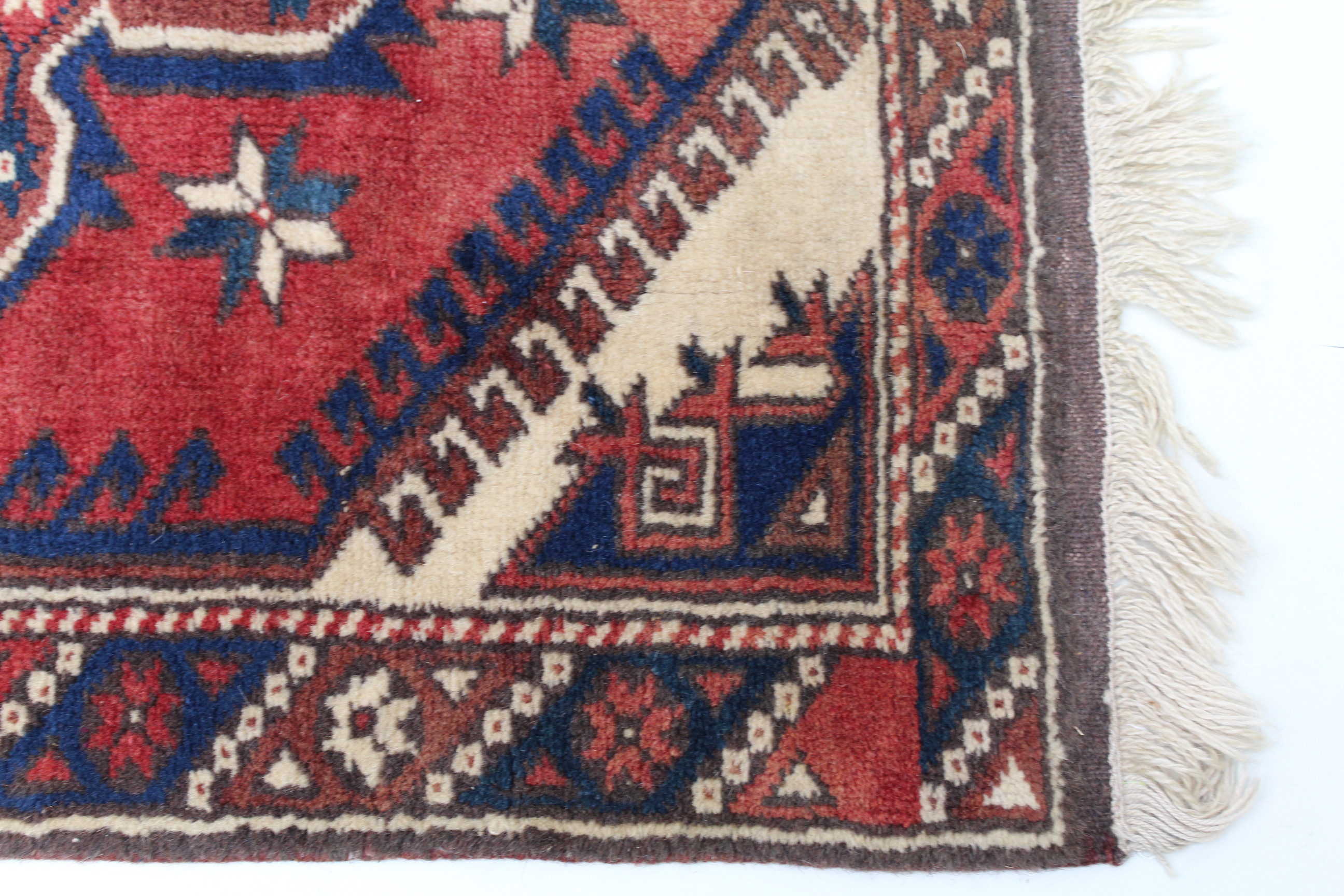 A TURKISH VILLAGE DOSEMEALTI RUG, having brick red field, with stylized geometric decoration, - Image 2 of 3