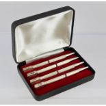 A SET OF FOUR STERLING SILVER BRIDGE PENCILS, each with a suit symbol to the top, cased