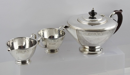 WALKER & HALL A THREE PIECE SILVER TEA SET, having applied wire rim with bright cut floral banding