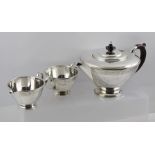 WALKER & HALL A THREE PIECE SILVER TEA SET, having applied wire rim with bright cut floral banding