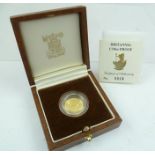 A BRITANNIA LTD EDITION GOLD PROOF 1/10oz GOLD COIN in presentation box, with certificate