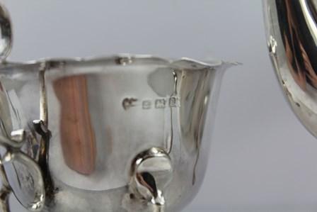 WILLIAMS (BIRMINGHAM) LTD. A THREE-PIECE SILVER TEA SET, each having cut shaped rim, plain belly and - Image 3 of 4