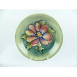 A WALTER MOORCROFT SHALLOW BOWL, "Dahlia" pattern, circa 1960, having tube lined and painted