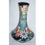 A MOORCROFT WAISTED TEAR-DROP STYLE VASE, "Passion Flower" pattern, having tube lined decoration,