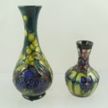 A SMALL MOORCROFT VASE, "Violet" pattern, impressed and painted factory marks to base, 10cm high,