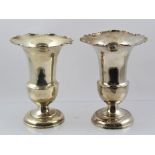 A & J ZIMMERMANN A PAIR OF LOADED SILVER TRUMPET SHAPE VASES, each having cut shaped rim, plain spun