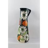 A MOORCROFT CERAMIC JUG, designed by Vicky Lovatt, tube lined and hand painted in the "Resplendent