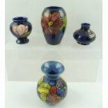 A MOORCROFT CERAMIC BALUSTER VASE, piped and hand painted "Clematis" design, bears paper label to