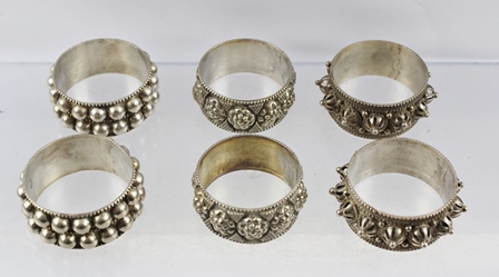 THREE PAIRS OF ASIAN SILVER NAPKIN RINGS with decorative designs