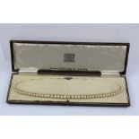 A GRADUATED CULTURED PEARL NECKLACE in it's original "Duchess Pearls" case, registration no. 426873