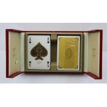 A "LES MUST de CARTIER" CASE CONTAINING TWO PACKS OF PLAYING CARDS, circa 1974