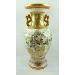 A JAPANESE KUTANI PORCELAIN VASE of baluster form with gilded handles to the neck, hand painted