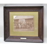 AN EARLY 20TH CENTURY GOLFING INTEREST FRAMED PHOTOGRAPH, depicting members posed outside of a