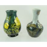 A SMALL MOORCROFT VASE, "Buttercup" pattern, baluster shape with tube lined and painted