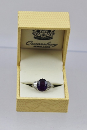 AN AMETHYST AND DIAMOND CLUSTER RING having central oval step cut amethyst, approx 3.95ct with - Image 2 of 4