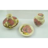 THREE PIECES OF MOORCROFT CERAMICS, "Pink Magnolia" piped and painted designs on a white ground,