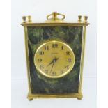 MOLNIJA A 1960'S/70'S RUSSIAN GILT BRASS MANTEL TIMEPIECE, having turned finials and serpentine