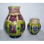 A MOORCROFT GINGER JAR AND COVER, "Violet" pattern introduced in 1991, 11cm high, together with a