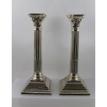 A PAIR OF EDWARDIAN SILVER PLATED COLUMN DESIGN CANDLESTICKS, Corinthian capitals with removable