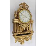 ISAK MOBECK OF NORSKOPING AN ORNATE EMPIRE GILDED CARVED WOOD CASED CARTEL WALL CLOCK, having 8-