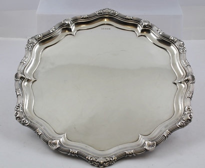 WALKER & HALL A SILVER DRINKS TRAY having heavy cast scallop and fancy scroll border, un-engraved