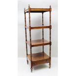 A REGENCY ROSEWOOD FOUR TIER WHATNOT, having turned finials and supports with drawer to base, raised