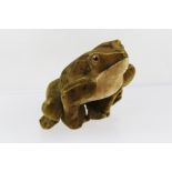 A MID 20TH CENTURY STEIFF FROG, being velveteen covered with glass eyes, button in webbed front