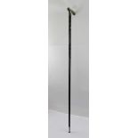 AN EARLY 20TH CENTURY CHINESE SILVER COLOURED METAL AND MALACCA LADY'S WALKING CANE having shaped