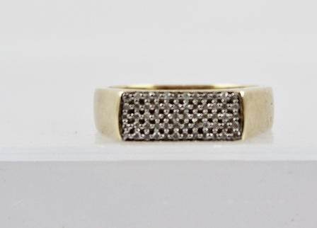 A 9CT GOLD UNISEX DIAMOND FINGER RING having a rectangular head set with 60 small diamonds, on a