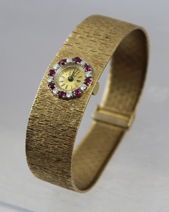 A LADY'S "BUECHE GIROD" 9CT GOLD INTEGRAL BRACELET WATCH, having bark textured bracelet, a bezel - Image 3 of 4