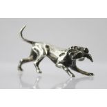 PETER JOHN DOHERTY SILVER LTD. A CAST SILVER MODEL OF A HOUND with a game bird in it's jaw,