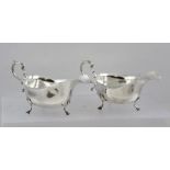 BARNSLEY & CO A PAIR OF GEORGE V CHIPPENDALE STYLE SILVER SAUCE BOATS each having a cut shaped