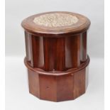 A LATE VICTORIAN MAHOGANY COLUMN FORM COMMODE with fabric inset hinged cover, fluted stem,
