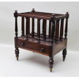 A 19TH CENTURY ROSEWOOD CANTERBURY, having turned finials and frame, fitted drawer to base, raised