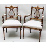 A PAIR OF LATE 19TH CENTURY MAHOGANY AND SATINWOOD OPEN ARMCHAIRS, each having lyre back, cream