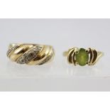 A 9CT GOLD DIAMOND SET RING of rope twist design and a 9CT GOLD PERIDOT SET RING (2)